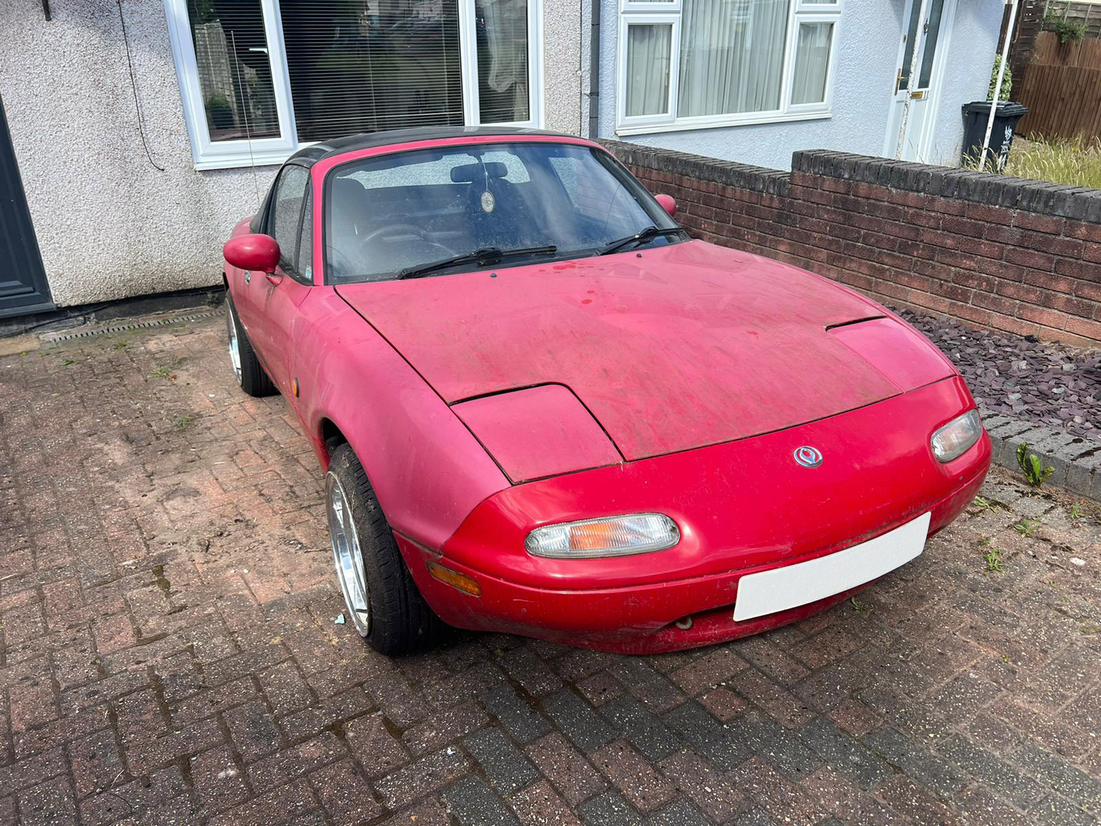 Mazda MX 5 with faded red paintwork